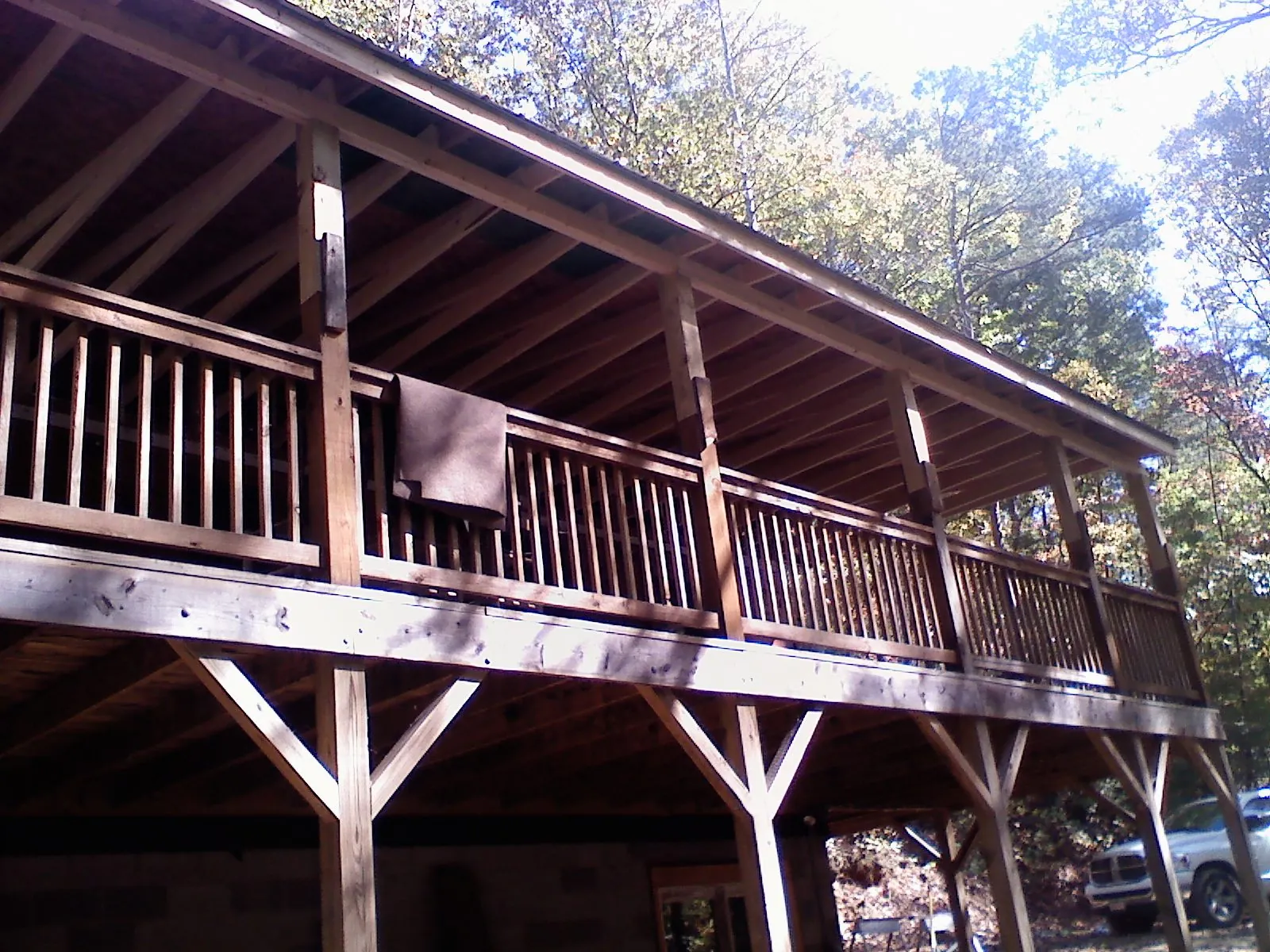 Timber framing under a new elevated porch and deck — Roof Leak Repair in Manitou by Roofing Brothers